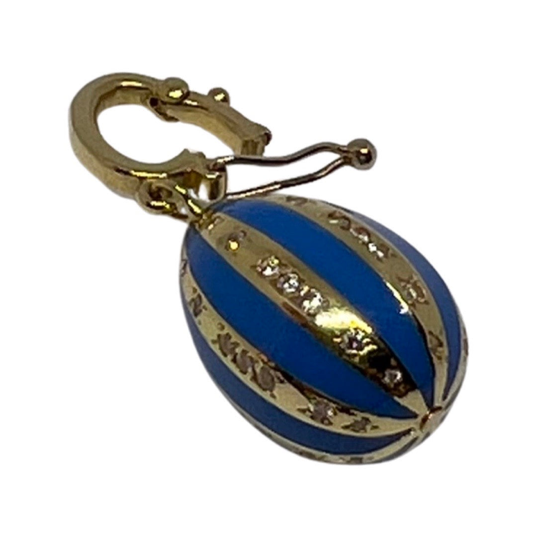 Turquoise enamelled Lucky beginning egg charm with diamonds in yellow gold