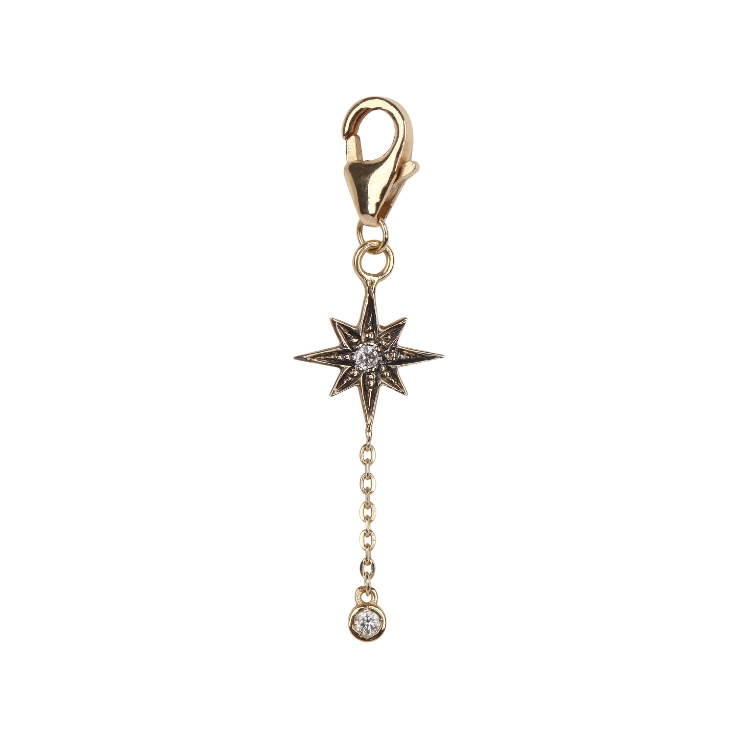 Black rhodium star charm with a diamond drop in yellow gold