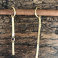 Two lines and a ruby earring long in yellow gold
